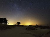 Winter sky - Pointe de Kerbihan - Bretagne France  ; On the horizon is. Orion and Gemini are just removed. Above, this is Capella in Auriga (left) and bull accompanied the Pleiades. The pale glow of the zodiacal light that starts from the bottom left bar the image to the upper right corner.