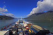 Ferry boat in Chilean Patagonia ; Ferry carrying vehicles in an area where the road carretera austral wasn't able to be built on land due to the steepness of the area. At 3 locations, the vehicles are boarded on ferries and the carretera austral is named ruta bimodal, due to the two means of transportation : by land an by ferries.<br>Maritime transfers :<br>- between Caleta Puelche and Caleta La Arena (30')<br>- between Hornopirén and Leptepu (3,5 hours)<br>- between Caleta Gonzalo and Fiordo Largo (30')