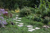 Japanese path in a flowered garden