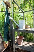 Gardener equipment in a greenhouse