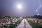 Power line struck by lightning during Cevennes episode ; Medium voltage line struck down with a short circuit on a post close to the photographer, about ten meters.<br>Heavy runoff in the fields and path.<br>Superposition of two photos 30 seconds equivalent to one minute of exposure