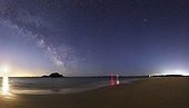 Milky Way in the sky illuminated by the moon - Houat France ; Despite the presence of the big crescent Moon, the Milky Way is still clearly visible. The black figure is the island of Er Yoc'h, while the far right, the white lights are those of the borough of Île d'Houat. 