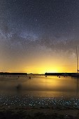 Milky Way and phosphorescent plankton - Hœdic France  ; Phosphorescent plankton light up the shore where small waves come to die. In the sky, the Milky Way at the The Big Summer.