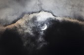 Partial Solar Eclipse - Brittany France ; A cloud of sail reduces sunlight and transforms the dazzling sun disk in a growing, albeit very bright, but bearable.