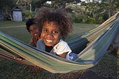 Girl in a hammock - Tanna Island Vanuatu ; 6 year old girl