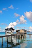 Handcrafted pearl farm - Fakarava French Polynesia ; transplant with his stilt house and his boat lifting gantry. Facilities located on the shore or too close to it can affect the quality of oysters. Indeed, water is often warmer and stagnant.