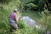 Man fly fishing - River Dessoubre France ; Fishing for European Grayling