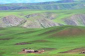 Mountain landscape with farm - Amdo Tibet China ; .