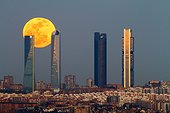 Full moon behind The four towers of Madrid - Spain