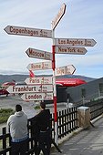 Denmark. Greenland. West coast. AIrport of Kangerlussuaq. Signpost with the distances to the main capitales of the world from the airport of Kangerlussuaq, main airport of the west coast for the local airline company Airgreenland.