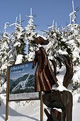 Map of ski slopes "La Planche des Belles Filles " and Jacques Pissenem wooden sculpture depicting the legend of Young girls suicide in the pond during the Thirty Years War, the town of Mines Floor , Vosges Massif , La France