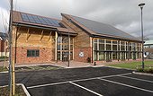 Thin film solar PV panels on Bloor Community Centre Zero Carbon Village Stoke Orchard Cheltenham UK