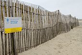 Lattice fence in wood to protect the dune from the beach of Odé Vras in Plounévez-Lochrist, Brittany, France