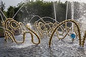 Jets of water and sculptures of Bosquet du theatre d'eau, Gardens of Versailles, France. Garden design : Louis Benech, artist : Jean Michel Othoniel