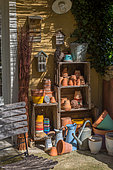Stored terracotta pots and traditional watering cans, Provence, France