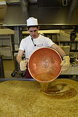 Manufacture of sweets, the boiled sugar is poured on the table, Confiserie des Hautes Vosges, Plainfaing, France