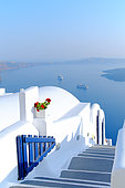 House with typical Cycladic architecture on the island of Santorini built on the volcanic cliff (caldera). Due to the low rainfall, the dwellings are not provided with tilesl. Oia, Greece.