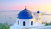 Sunset on the chapel of Imerovigli, village located 2 KM from Fira at overlooking the caldera. Santorini, Cyclades, Greece