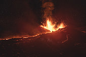 Photographer on Piton de la Fournaise in activity, Volcano eruption 13 of september 2016, Reunion