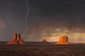 Lightning strikes during a thunderstorm in the evening light, composite, mesas with West Mitten Butte, East Mitten Butte, Merrick Butte, Monument Valley, Navajo Tribal Park, Navajo Nation Reservation, Arizona, Utah, United States of America, USA, North America