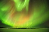 Polar lights, Aurora borealis, above the frozen Lake Inari, Lapland, Finland, Europe