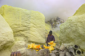 Indonesia, Java Island, East Java province, Kawah Ijen volcano, Miner preparing sulfur blocs