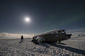 Shooting in midnight sun of the carcass of a US Army DC3 on the beach of Sólheimasandur, Iceland