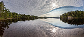 Perfect reflection in Sandsjön lake, in south-west Sweden at the end of summer.