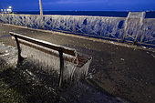 Bench and balustrade frozen in Evian, on the front of Lake Geneva, France