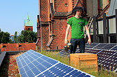 Urban Beekeeping - Philipp Markert, 26 years old, with his hives on the Church of the Resurrection steps from Alexanderplatz and Karl Marx Avenue. Following the fall of the Wall, the church was transformed, into an environmental conference center with a vegetal roof and solar panels to produce electricity. “I work as the head cook in a restaurant and I also studied to be an engineer in wood technologies at university… I started beekeeping two years ago after a seminar on bees. I hate pesticides and I shop for organic products at the local markets. It’s hard to be an ecological activist in Germany so I defend traditions, good cooking and organic products and I boycott supermarkets and the food industry that uses pesticides.” Germany