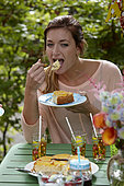 Lady eating orange cake