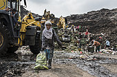 Ragmen in the Bantar Gebang landfill, In Indonesia, on the outskirts of Jakarta, lies the Bantar Gebang site, the largest open-air dump. All day, men, women and children, get what can be resold.