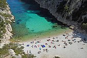 Tourists at beach with turquoise water, Calanque d'en Vau, Calanques National Park, Provence, France, Europe
