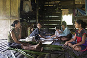 Women in the kitchen preparing sago, Pulau Siberut, Sumatra, Indonesia
