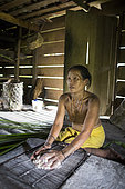 Woman preparing sago, Baitari, 38 years old, Pulau Siberut, Sumatra, Indonesia