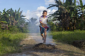Boy jumping over the fire, Pulau Siberut, Sumatra, Indonesia