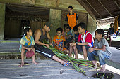 Teacher and students at the Sekolah Patas, an unofficial, non-governmental school , Pulau Siberut, Sumatra, Indonesia