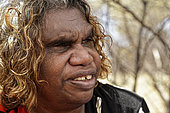 The Honey Ants Dream. Portrait of Audrey Martin, a 59-year-old Aborigine woman. Her mother's generation was the first to have contact with civilization and she still possesses the knowledge of the elders. Traditions are rapidly being lost and acculturation has been accelerating since contact with civilization. Learning about life in the desert had been gradual and depended on the youths' age. The secrets and the know-how were handed down as the person matured. The traditions linked to the boomerang were lost within one generation. Learning about and making the boomerang began when the youths were physically and spiritually ready. The elders have not been able to carry on this tradition. TV, video games, internet intensify acculturation. Northern Territory, Australia