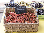 Dried tomatoes and olives on a market of Provence in summer, France