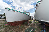 Working on lobster boats in the Spring. Chebeague Island, Casco Bay, Maine