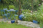 Garden furniture: table, chair. Scarecrow. Mainly blue garden. France