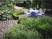 Flowered terrace: Geranium (Geranium sp), Rose (Rosa sp), Astilbe (Astilbe sp), Hosta (Hosta sp), Boxwood (Buxus sp), Private garden, Mr and Mrs Deferme, Belgium