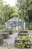 Greenhouse and square foot gardens with hazel wood weave