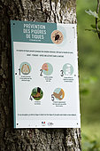 Sign on a tree, Prevention of tick bites (Ixodes ricinus) in forest, under the Ballon de Servance, Plancher les Mines, Haute-Saone, Vosges, France