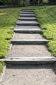 Steps made in a railway crossing in an alley, autumn, Somme, France
