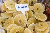 Candied pineapple slices on a market stall, summer, Provence, France