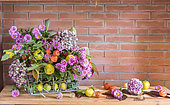 Autumn bouquet composed of chrysanthemums, hydrangea, physalis and quinces