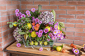 Autumn bouquet composed of chrysanthemums, hydrangea, physalis and quinces