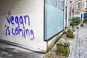 Graffiti 'Vegan' in a passage in downtown Limoges, France