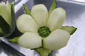 Food carving, making flowers from fruit and vegetables for salad